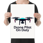 Person holding the drone pilot on duty poster to show its layout