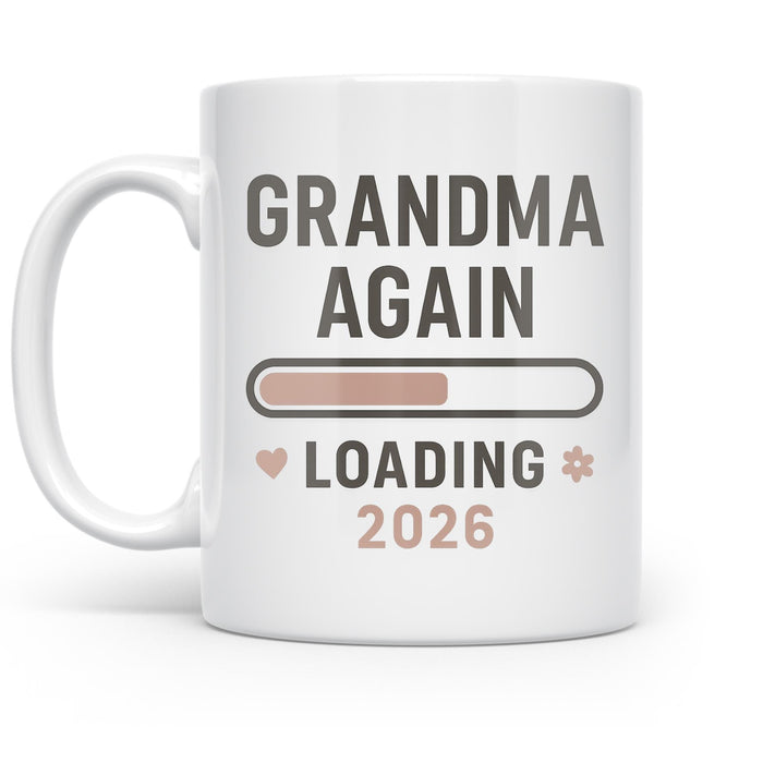 White mug with Grandma Again Loading 2026 lettering, a progress bar, and small pastel accents