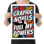 Graphic Novels Fuel My Powers poster with comic bursts, bold lettering and a hero silhouette, shown held for scale