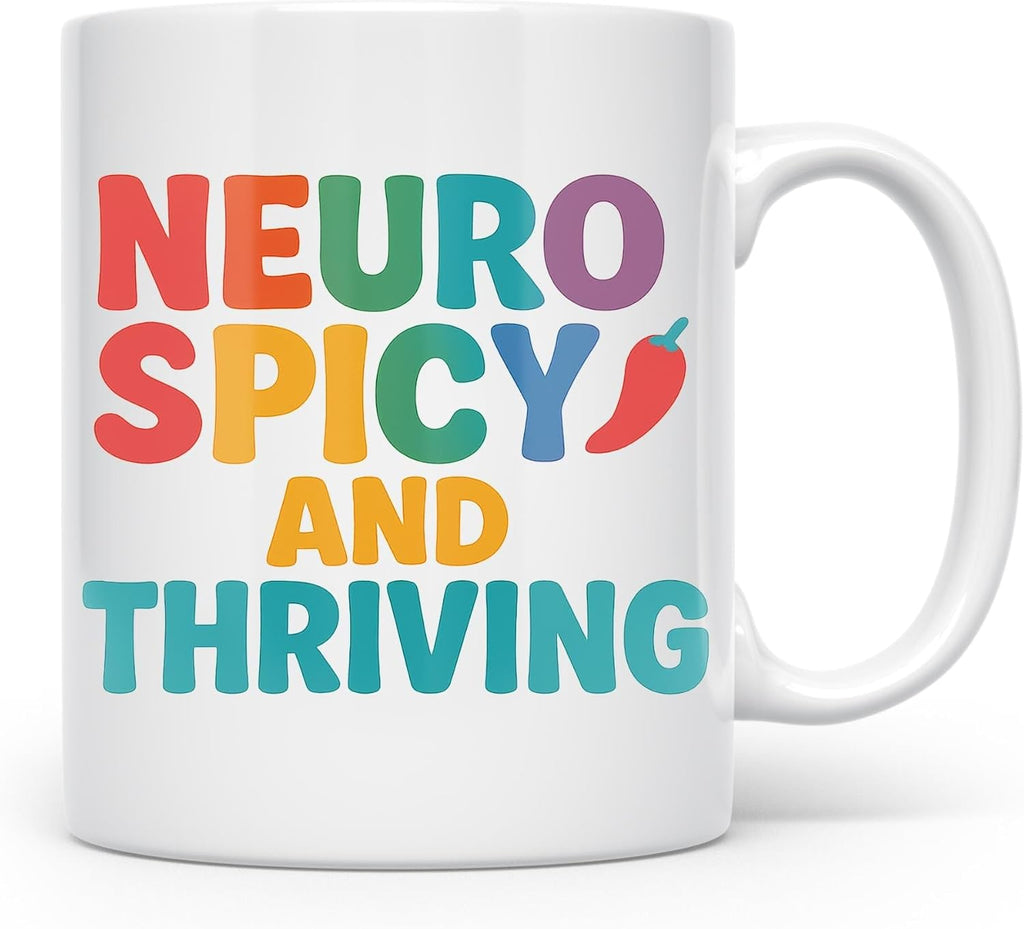 Neurospicy and Thriving mug with colorful lettering and chili pepper detail, handle on the right
