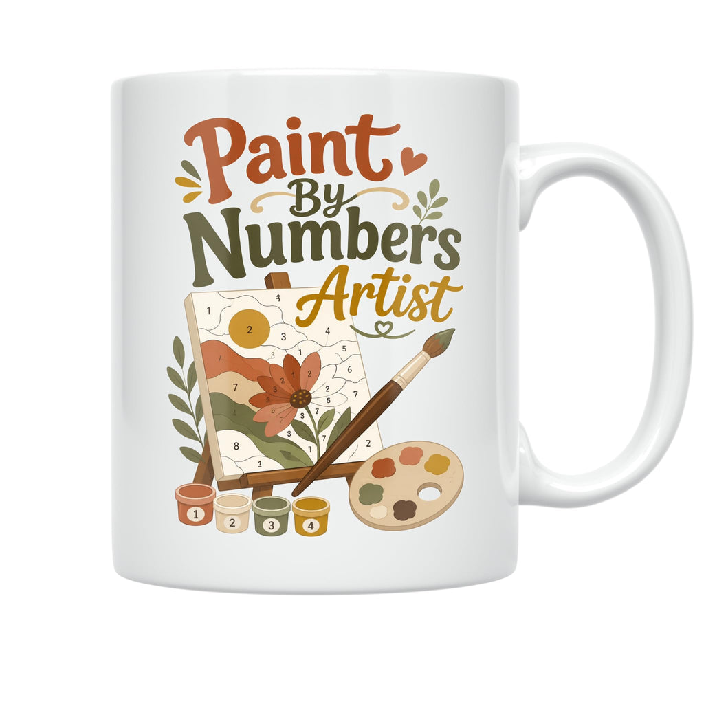 White Paint By Numbers Artist ceramic mug with a floral canvas, paintbrushes, palette and numbered paint pots, opposite-side mug view