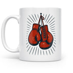 White ceramic mug with red boxing gloves and black vintage-style sunburst lines