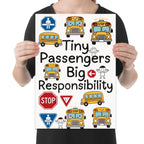 Tiny Passengers Big Responsibility poster with smiling yellow school buses, road signs and childlike figures shown in a held-poster mockup